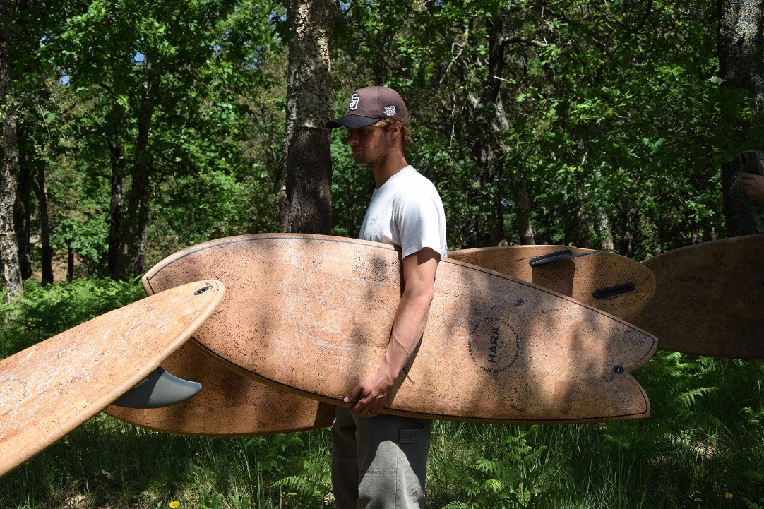 Carrying cork-surfaced Hara boards through the forest